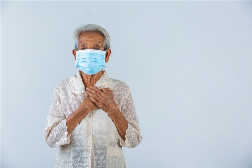 grandmother-is-puting-her-hands-in-the-lock-and-hoped-for-the-best-cencept-mask-campaign.jpg